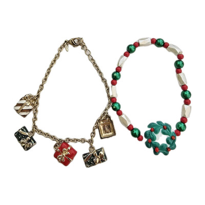 2- A Pair Of Christmas Bracelets- 1 SAQ Gift Charms 1 Porcelain Wreath Magnetic