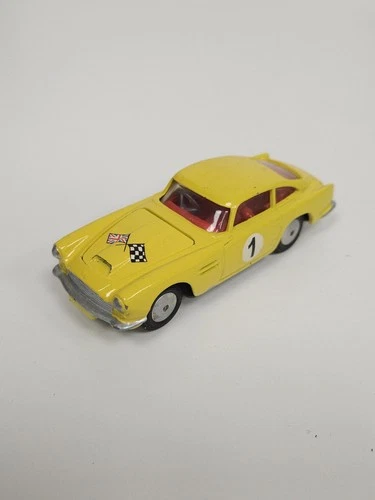vintage CORGI TOYS - ASTON MARTIN DB4 , 218, c1960 - Yellow code 3 rally car