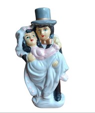 A Ceramic Figurine Of A Bride And Groom Wedding Cake Topper Hand Painted 1960's