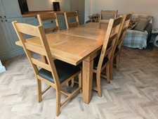 Solid Oak Dining Table with 6 leather Padded Chairs.