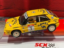 SCX 1/32 Scale Advance Lancia Delta Integrale-Servia with lights- E10521X300 New
