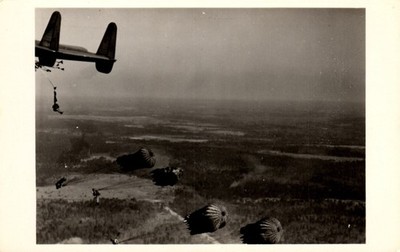 Postcard paratroopers, jumping out of Fairchild XC   120 Airplane RPPC