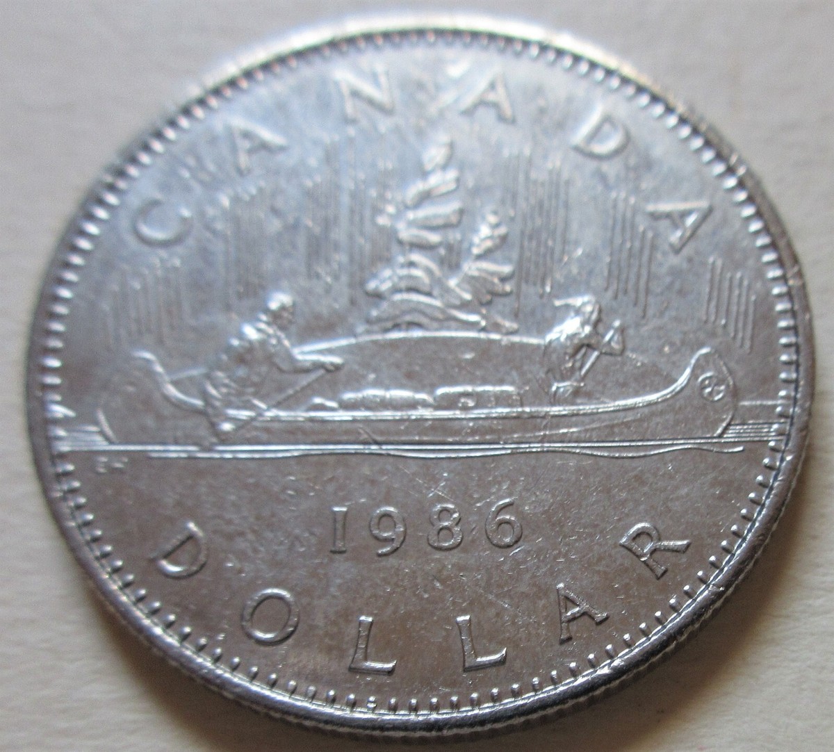 1986 Canada Canoe Nickel Dollar Coin. Canadian $1 voyageur Dollar