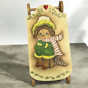 Hand Painted Holiday Raccoon on a wooden sled. Christmas Holiday Decor