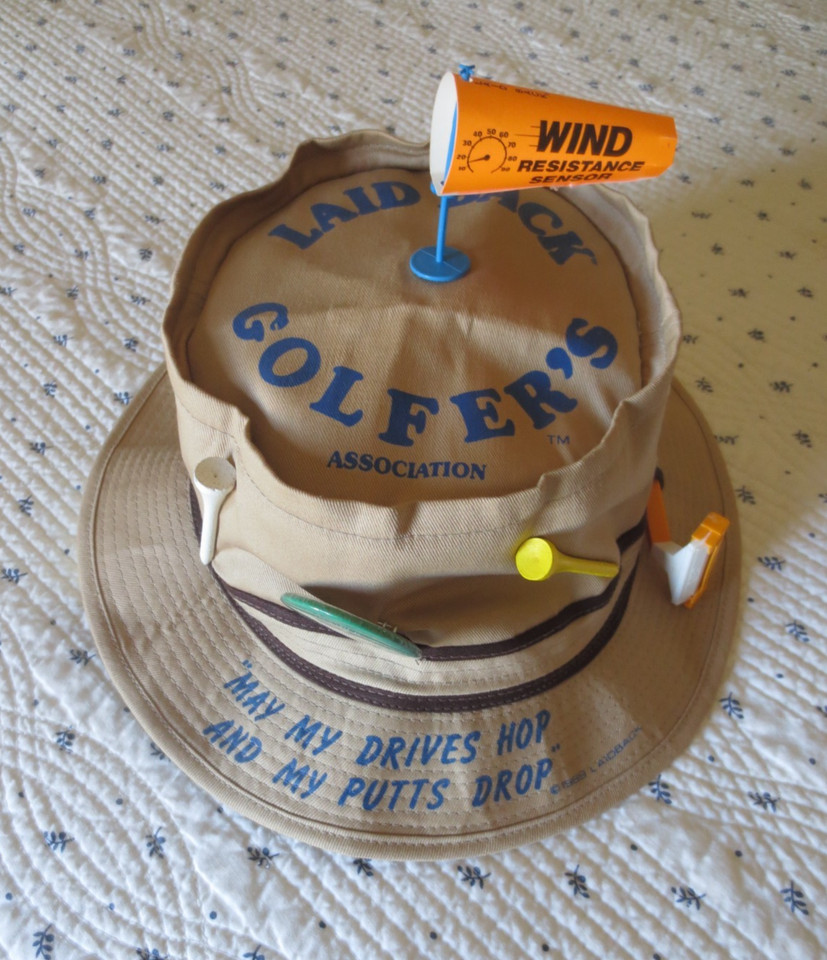A deadstock 1989 novelty golf hat with original tags — wearable vintage humor that's actually rare, not manufactured nostalgia.