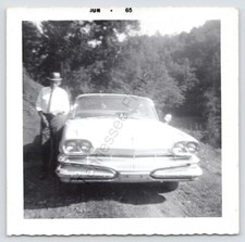 1965 Photo Man Standing Beside His Car Black And White