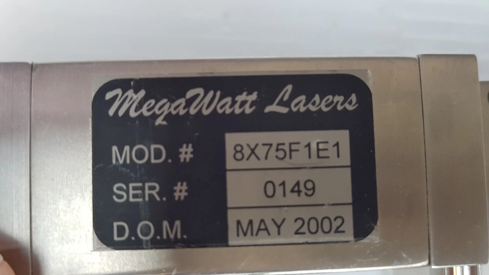 MegaWatt Lasers label: MOD. # 8X75F1E1, SER. # 0149, D.O.M. May 2002