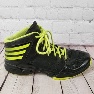 black and yellow adidas high tops