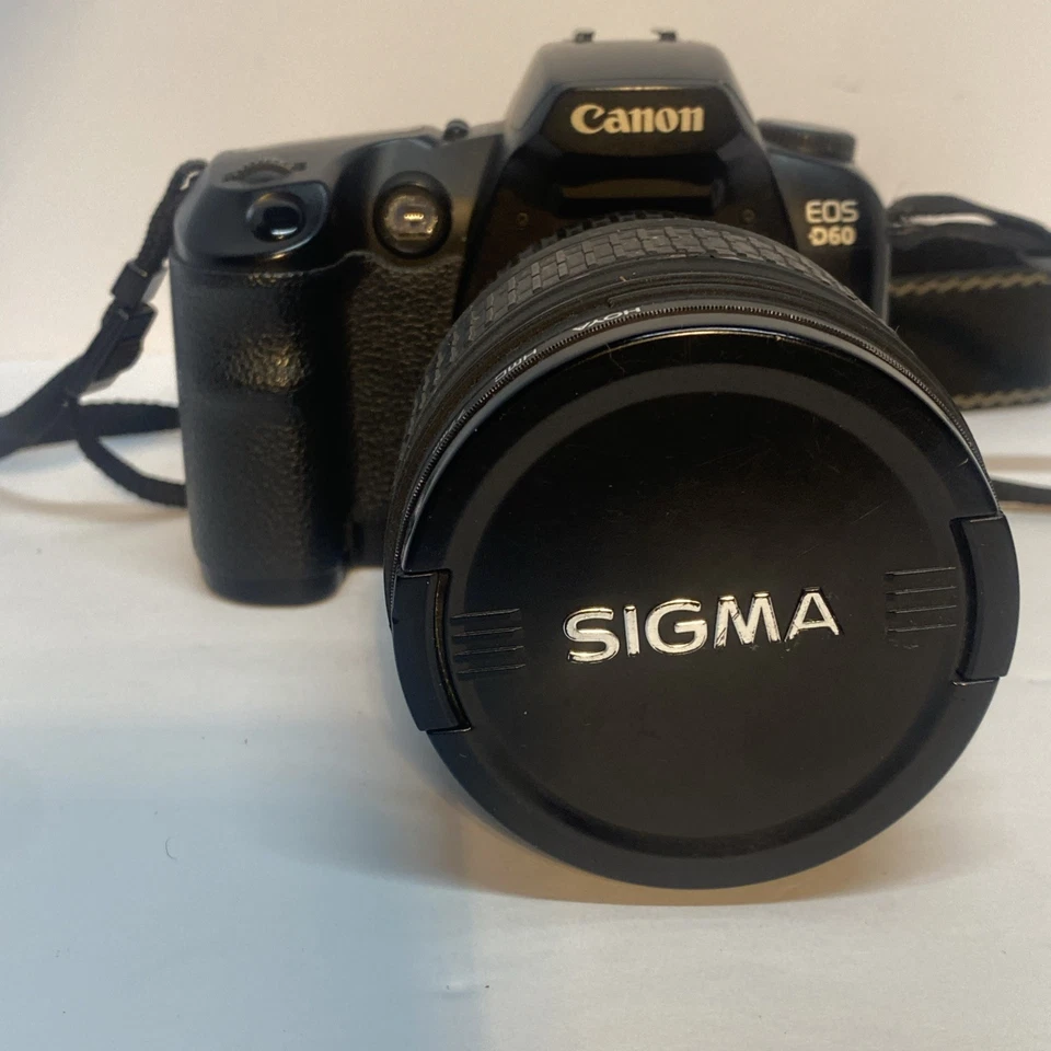 Lente zoom vintage Canon EOS D60 con Sigma AF-MF 28-70 mm F2,8 Ex asférica DF y + Foto 2 de 4