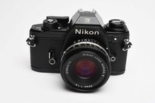 Nikon EM 35mm SLR w/Nikon Nikkor 50mm f1.8 lens, strap, cap, UV, CR, new seals