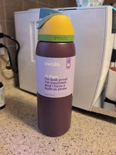 Owala FreeSip Stainless Steel Water Bottle / 40oz / Color: Jazz Fest