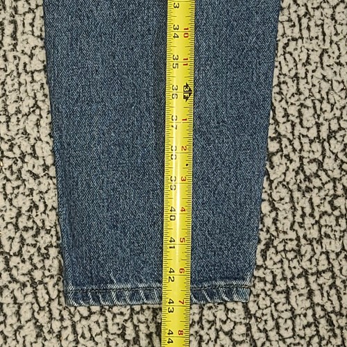 Blue high-waisted L.L.Bean mom jeans, made in USA, size 12, with yellow measuring tape across the waistband.