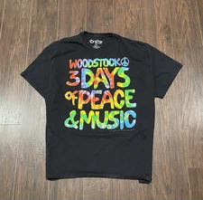 Liquid Blue Woodstock: Three Days of Peace band tee.
