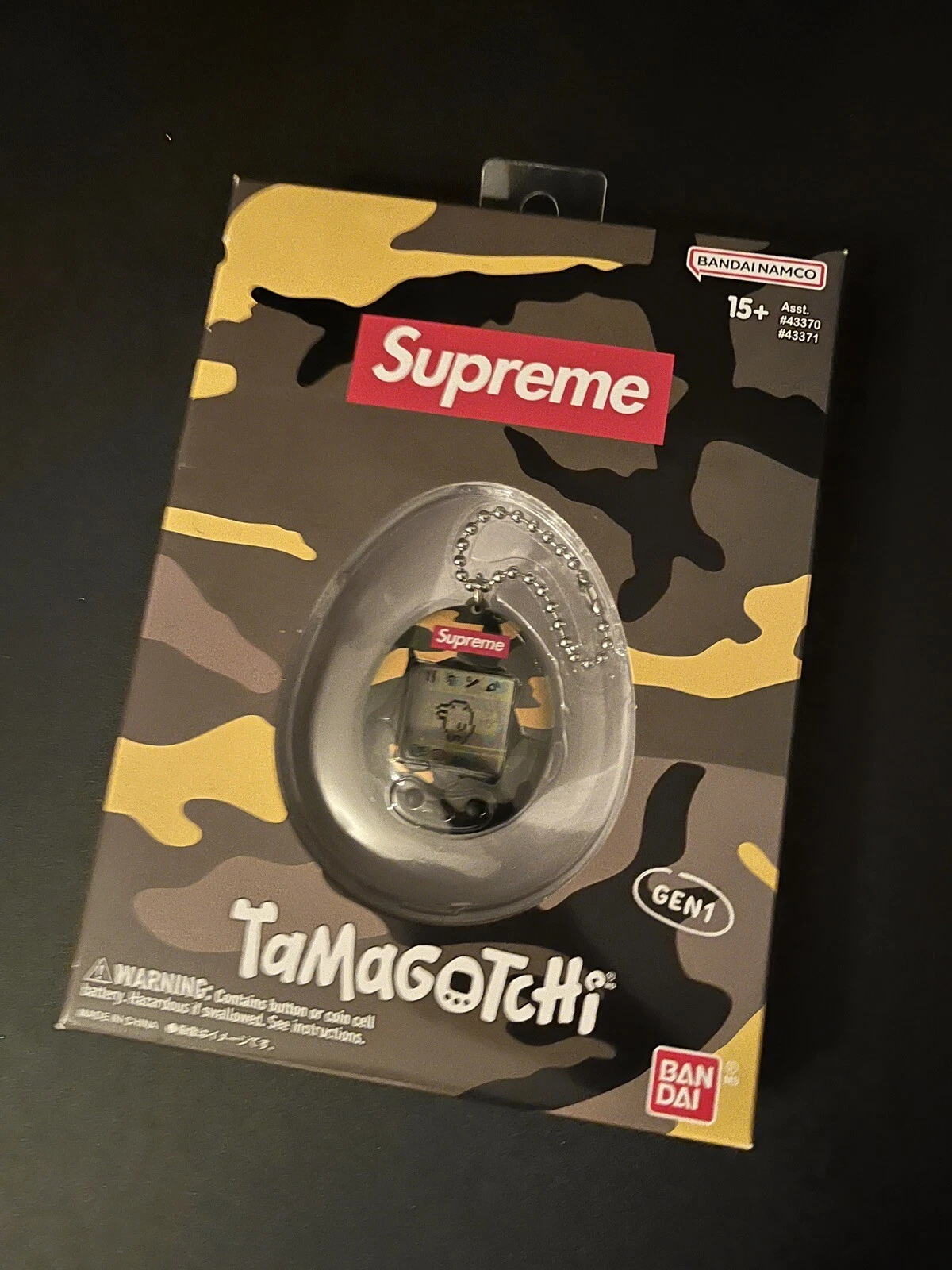 SUPREME Tamagotchi vert jaune camouflage scellé dans sa boîte flambant neuf cadeau à collectionner