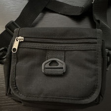 Black Tactical Gear Bag with Adjustable Strap and Multiple Pockets