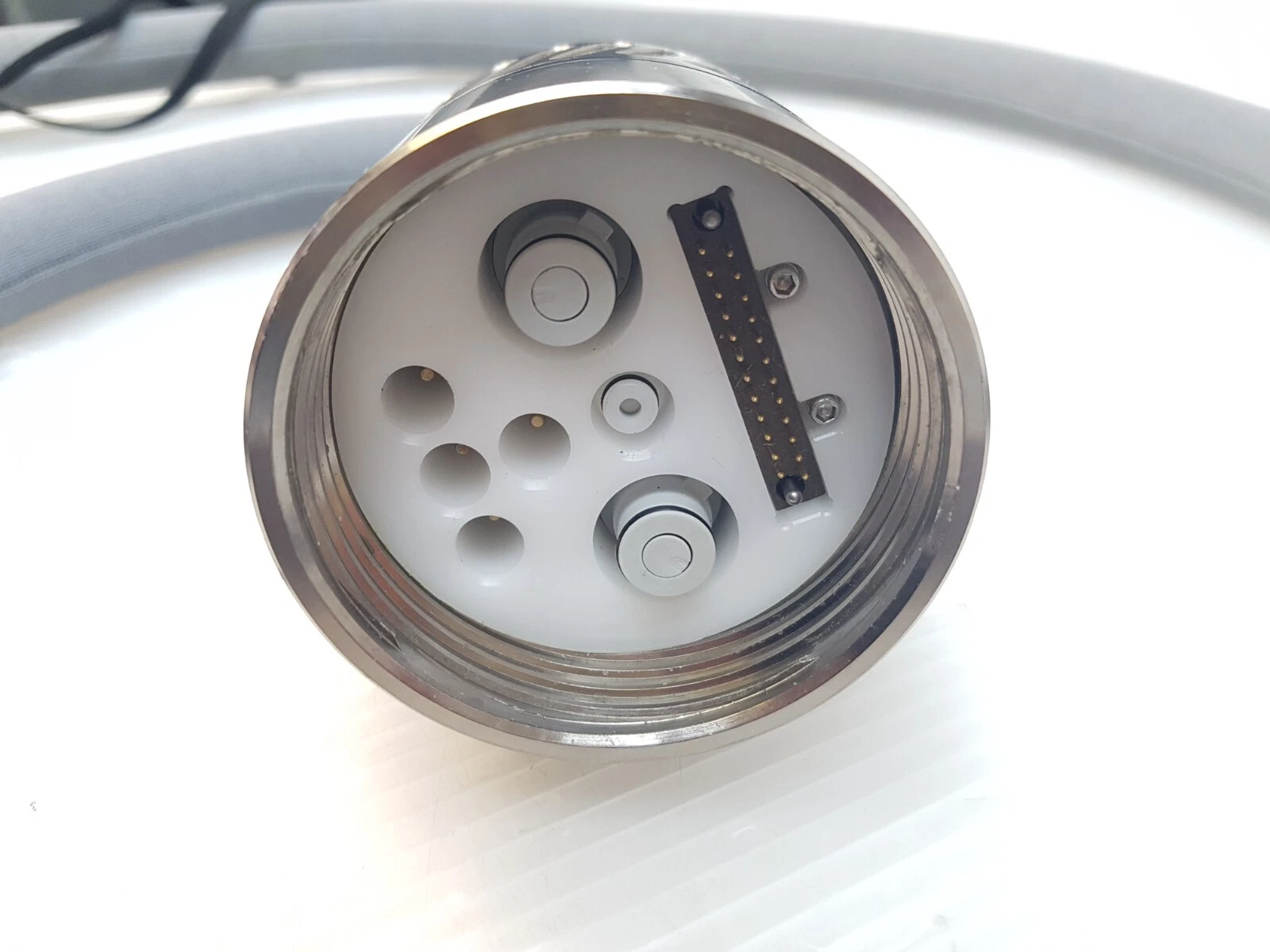Connector face of the LightSheer handpiece cable with multi-pin connector and ports