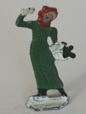 Vintage Heinrichsen German Flat Lead Woman Skater figure, Christmas
