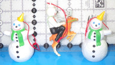 3 jack in the box ornaments 2 plastic snowmen rubber Jack riding a reindeer
