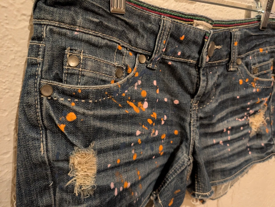 Delia's Denim Short, Very Low,Hip Hugger Y2K Paint Splatter. Sz 5jr Distress. - Image 2 of 4