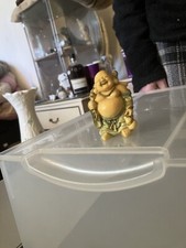 Standing Buddha with large sack