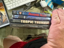 LOT OF 4 VARIOUS DVDS - PARANORMAL STATE, TROPIC THUNDER, SAINT, PARADISE ALLY