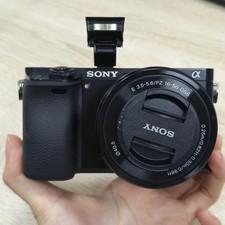 Black Sony Alpha A6000 Digital Camera w/16-50mm Lens with Accessories English