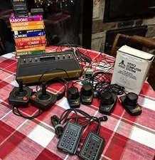 Atari 2600 Game Console w/2 Joysticks 4 Paddles, 2 Keyboard Controller, 18 Games