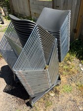 Stackable event chairs with dolly. Lightly us...