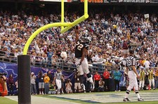 San Diego Chargers Courtney Van Buren slams dunks a ball at a game- Old Photo