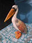 A rustic, stylized pelican figurine — photo 2
