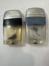 Vtg  (2) Scripto VU Lighters Fishing Fly Lure And Sailfish Picture - Not Tested