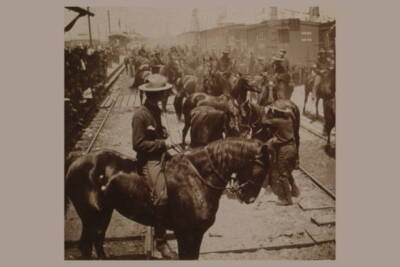 Crowded Scene of horses and riders disembarking from trains at Tam- Old Photo