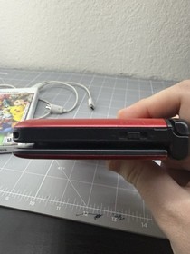 Nintendo 3ds Xl Red Used. Comes with Stylus, 4gb Sd Card, and Charging Cable.