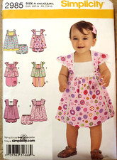 Simplicity 2985 Babies dress in two lengths, Top, Cropped Pants, Panties xxs-L
