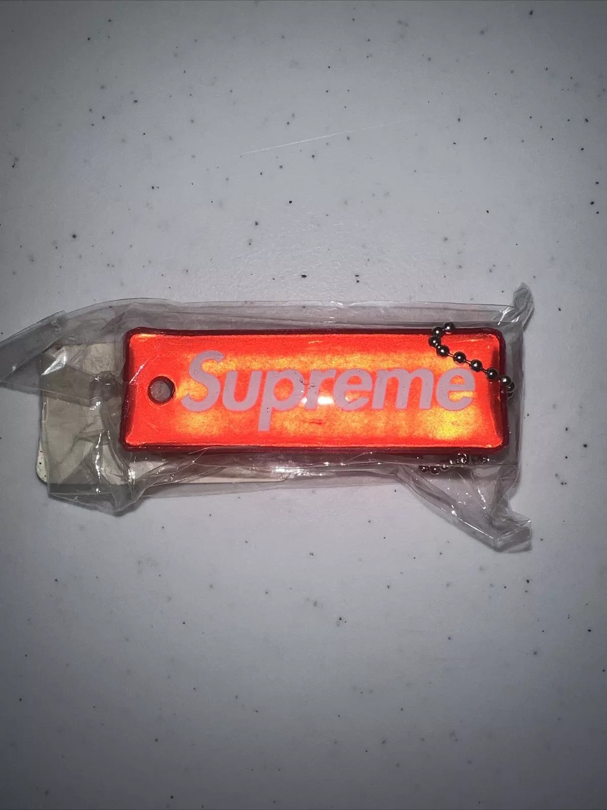 2014 PORTE CLÉS SUPREME REFLECTIVE PUFFY ROUGE NEUF BOÎTE CDG LOGO PCL SUPER RARE !!