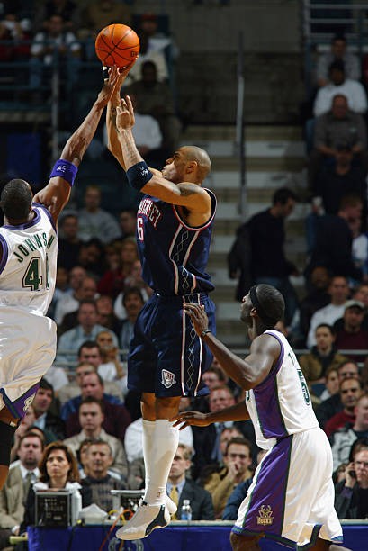 Kenyon Martin New Jersey Nets shoots over Ervin Johnson Milwaukee- 2002 Photo