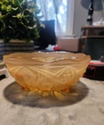 Vintage amber glass, footed bowl. carnival glass or depression with pattern.