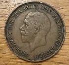 1936 George V penny showing right-facing profile with text “GEORGIUS V DEI GRATIA: BRITT: OMN: REX: FID: DEF: IND: IMP:”