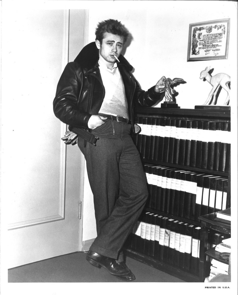 James Dean Wearing Black Leather Jacket and Smoking a Cigarette