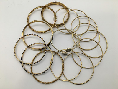 COLLECTION OF FIFTEEN GOLDTONE BANGLE BRACELETS