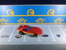 1983 Hot Wheels Corvette Stingray Red Metalflake w/Orange Yellow White gold bw