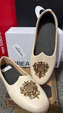 cream/beige Punjabi Jutti or Mojari shoes made from faux leather with...