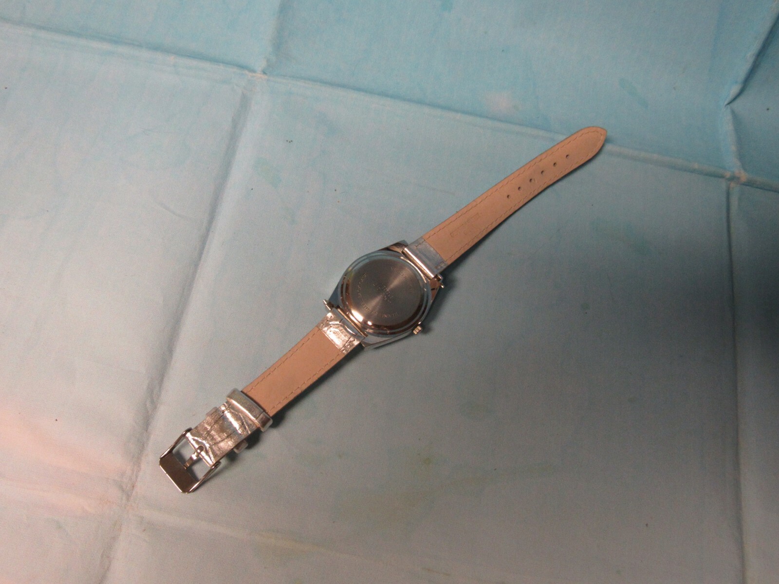 Ladies Watch With Spinning Rhinestones a Silver Leather Band and a New Battery 