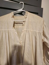 Edwardian cotton nightgown features a gathered yoke, long sleeves, RuffledCollar