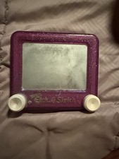 Travel etch a sketch purple. Has scratches from play see pics