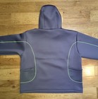 Gray Nike Project FROG hoodie back with green mesh panels, zipper, and two front pockets on wooden floor.