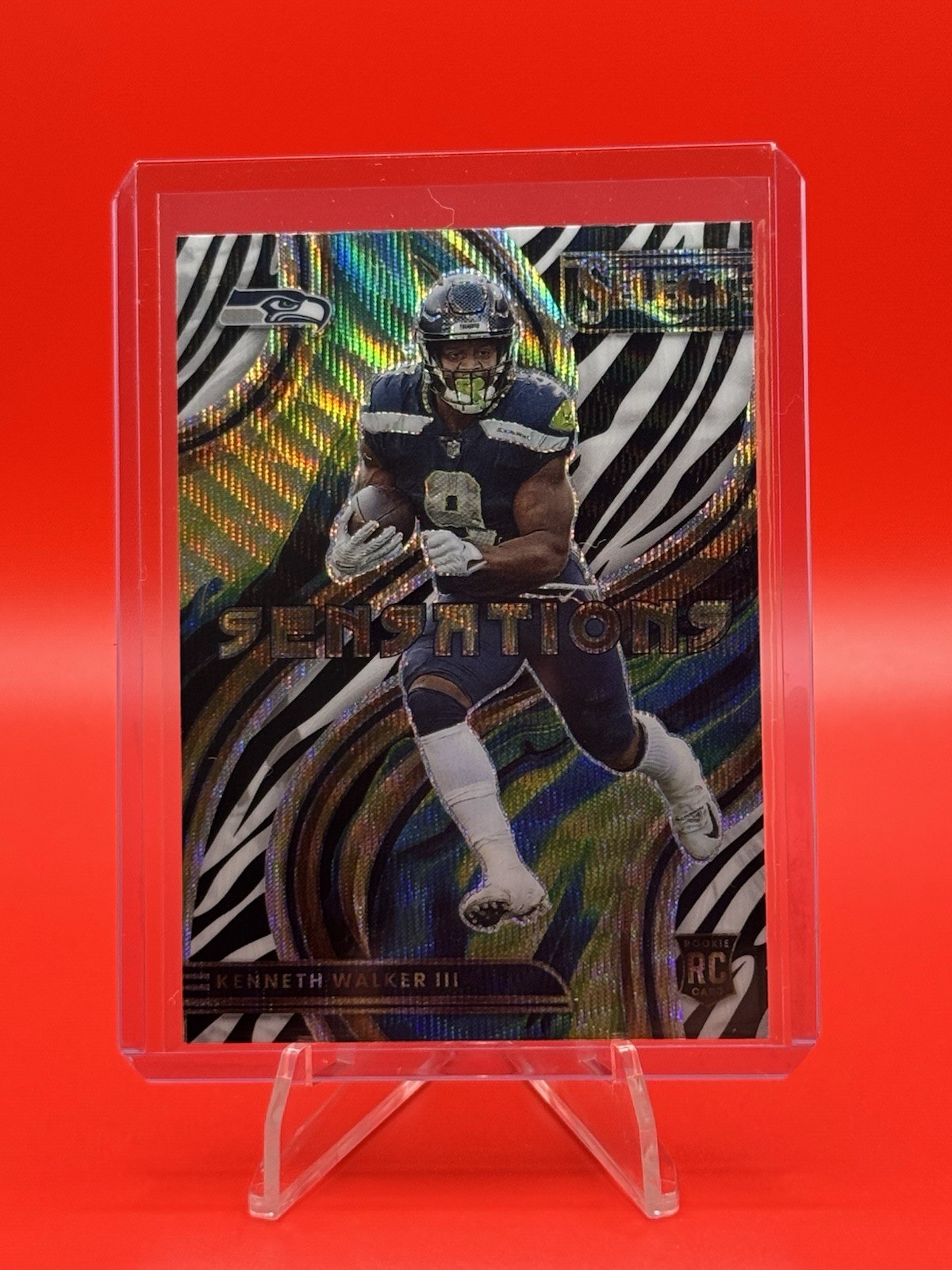 2022 Panini Select Sensations Kenneth Walker III #SEN-22 Zebra Prizm (RC)