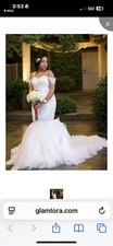 Bridal gown never worn. Trumpet mermaid style, off the shoulder with train.