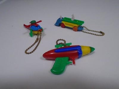 3 Vintage Pull Apart Plastic Puzzle Keychains Helicopter-Ray Gun-Fire Truck