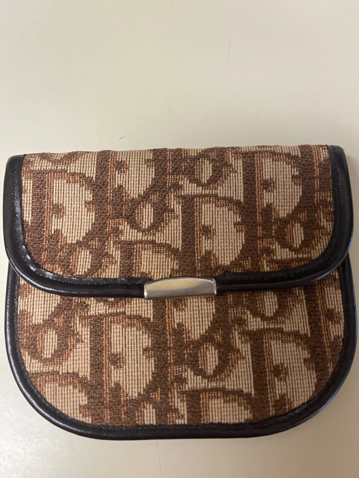 Porte monnaie trotteur marron Christian Dior.